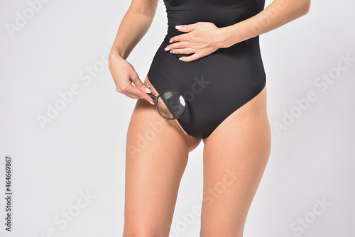 Woman looking her intimate bikini zone