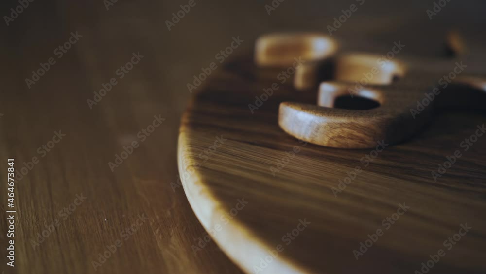 A wooden kitchen board is spinning on the table A wooden kitchen board is spinning on the table