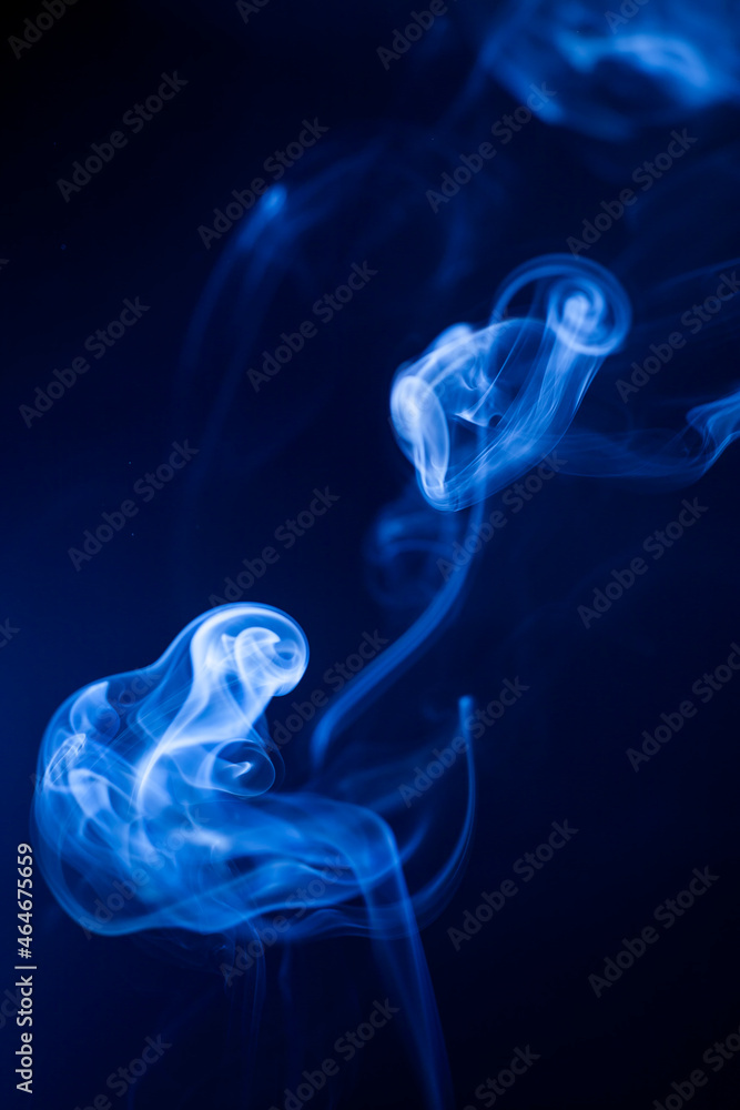 Motion blue smoke on black background.