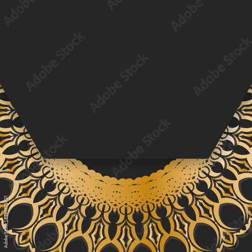 Postcard in black color with a mandala in gold ornament prepared for printing.