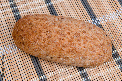 Beautiful fresh bread on wooden background