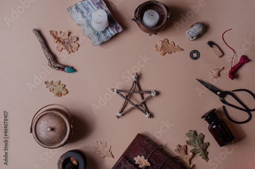 Mystical minimalistic spiritual background with occult objects flat lay beige pentagram ritual photo