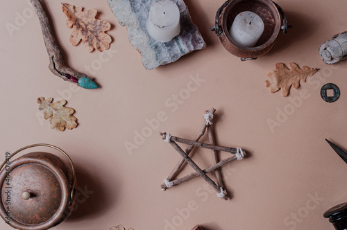 Mystical minimalistic spiritual background with occult objects flat lay beige pentagram ritual photo