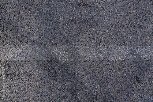 Aerial top view abstract texture and background of car tire drift skid mark on road race track, Black tire mark on street race track, Automobile and automotive concept.