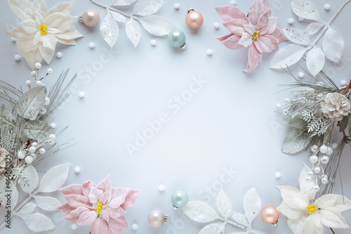 Christmas and New Year holidays frame. Christmas ornaments on light pastel background. Flat lay, copy space.