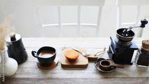 Coffee and muffin and coffee grinder