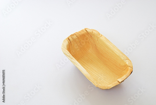 Organic rectancular bowl made from leaves of the areca nut palm isolated on white background. Bio-degradable food container made from plant leaves which is good for consumer and save the environment.