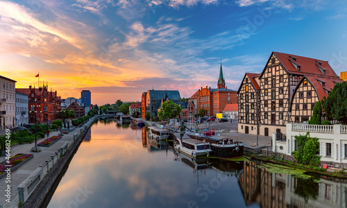 Panorama of Old town with reflection in Brda River at sunrise  Bydgoszcz  Poland