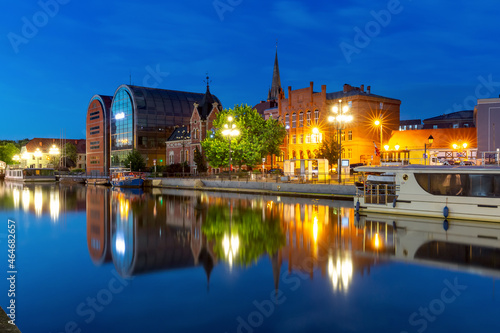 Panorama of Old town with reflection in Brda River at night, Bydgoszcz, Poland
