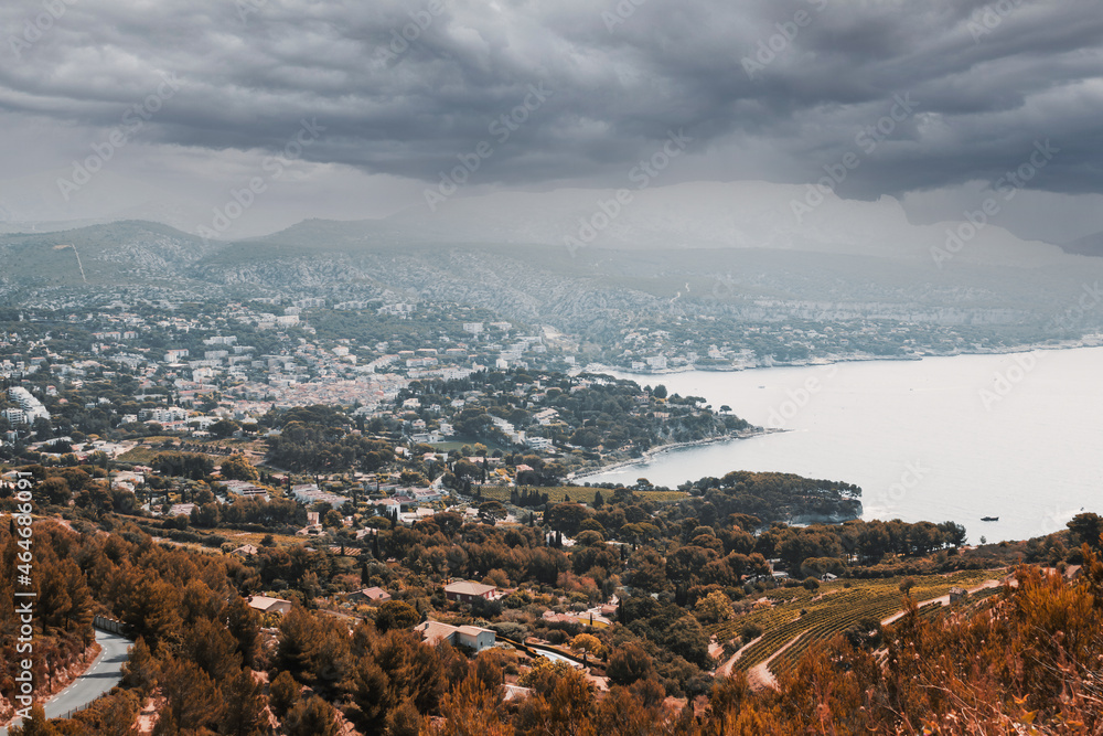 Fototapeta premium a city in autumn with gray clouds in the sky