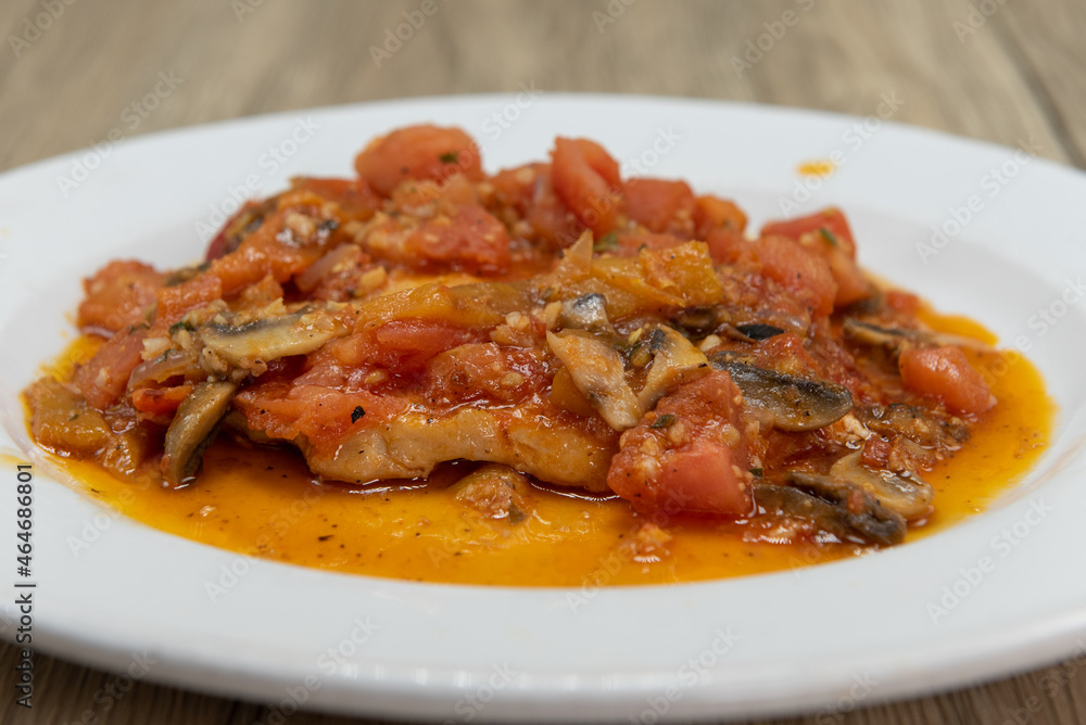 Chicken cacciatore meal with pasta served in an authentic Italian sauce for a delicious meal Chicken cacciatore meal with pasta served in an authentic Italian sauce for a delicious meal