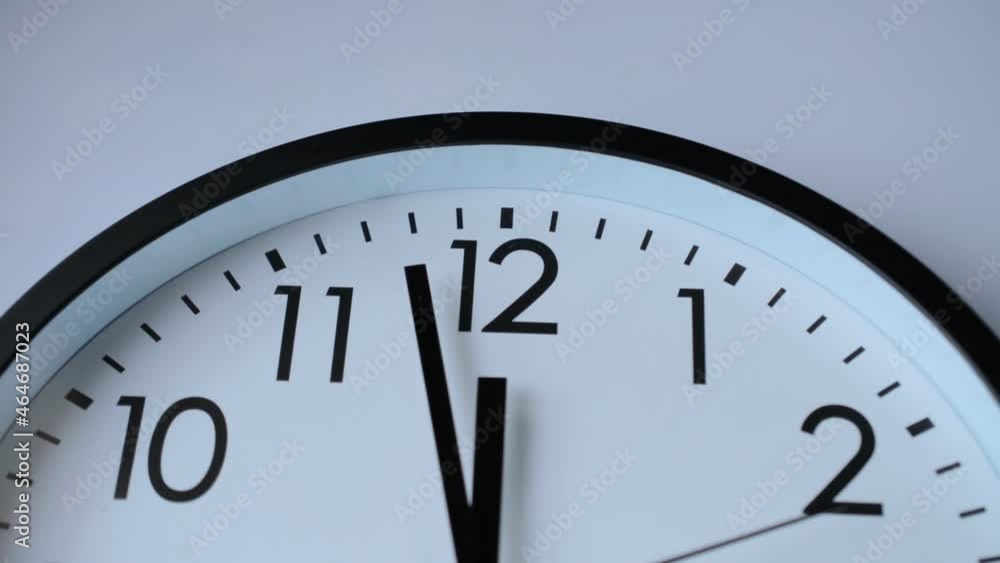 Time lapse clock ticking showing twelve o'clock face close Time lapse clock ticking showing twelve o'clock face close