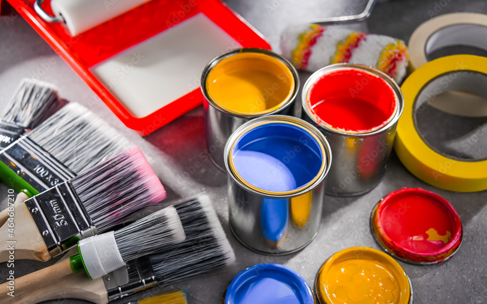 Paintbrushes of different size and paint cans Paintbrushes of different size and paint cans