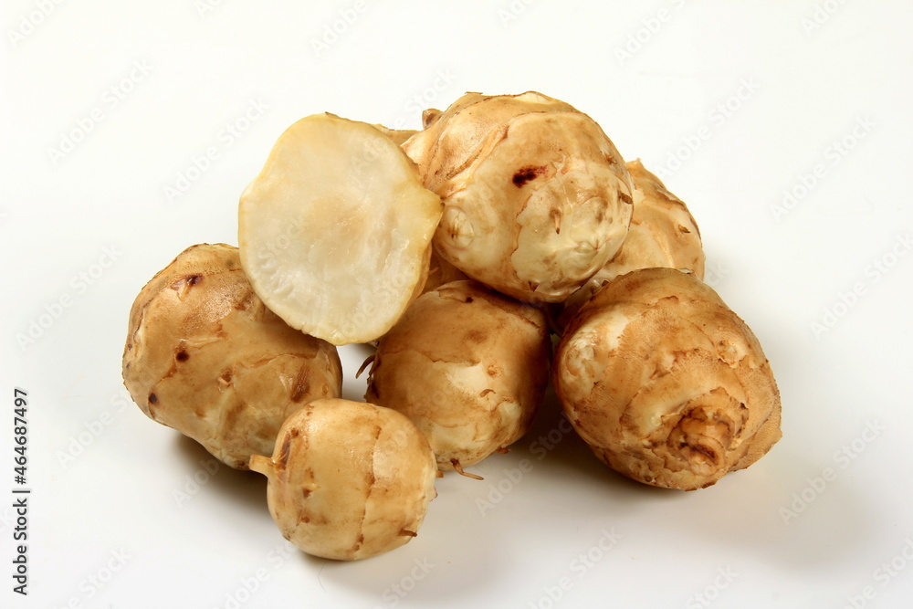 Jerusalem artichoke with white background, close up. Freshly harvested Jerusalem artichoke or topinambur Jerusalem artichoke with white background, close up. Freshly harvested Jerusalem artichoke or topinambur