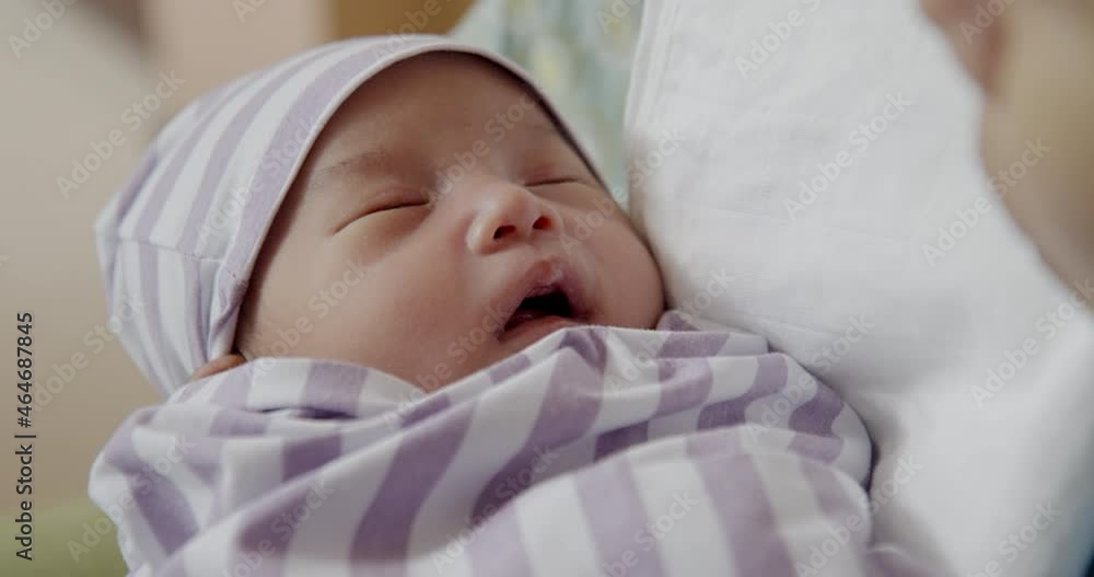 Authentic Close-up Shot - Asian baby girl sleeping with mouth open in mother’s arms after being nursed. Neonatal care, parenthood, maternity, motherhood, family love and bond concept. Authentic Close-up Shot - Asian baby girl sleeping with mouth open in mother’s arms after being nursed. Neonatal care, parenthood, maternity, motherhood, family love and bond concept.