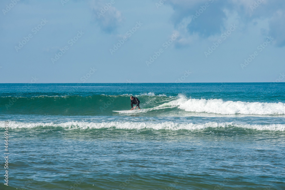 senior surfer in action in the waves