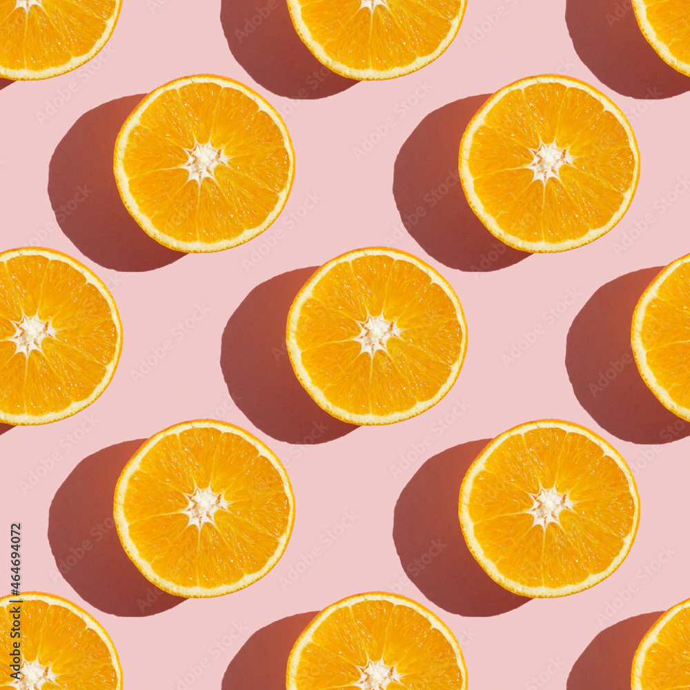 Fruit pattern of fresh ripe slice orange on pink background. Top view, copy space for your text. Fruit composition, healthy concept. Fruit pattern of fresh ripe slice orange on pink background. Top view, copy space for your text. Fruit composition, healthy concept.