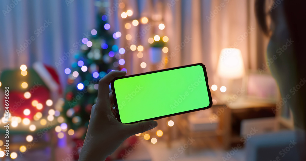 woman use green screen smartphone