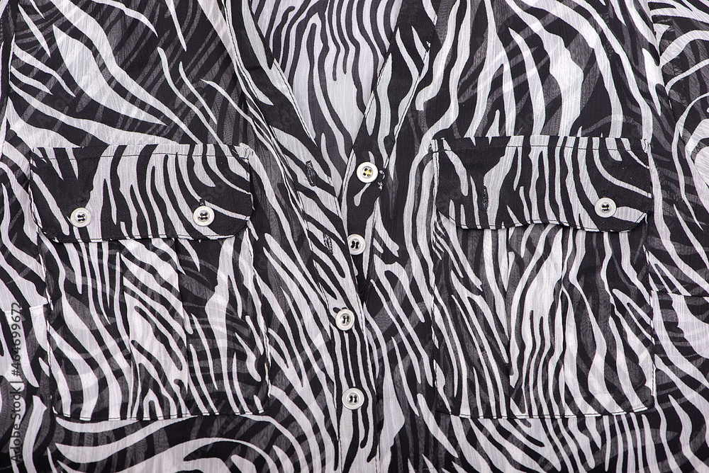 silk blouse fabric texture close-up with pockets, buttons, black and white floating line pattern silk blouse fabric texture close-up with pockets, buttons, black and white floating line pattern