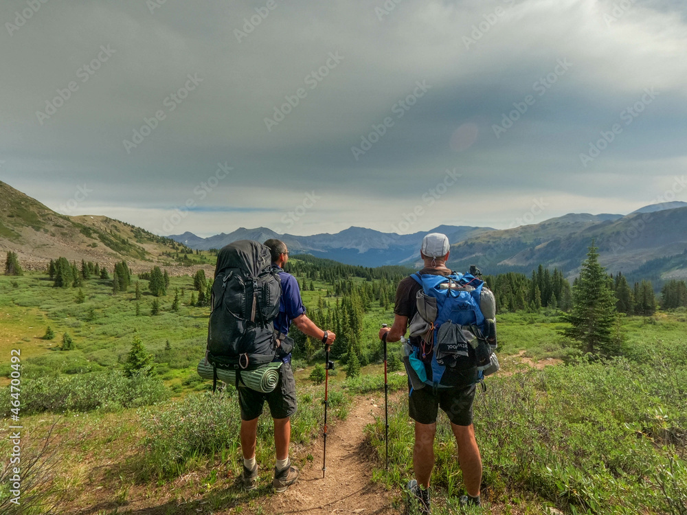 Thur-hikers looking at the distant view of the  Collegiate Peaks on the 485 mile Colorado Trail, Colorado