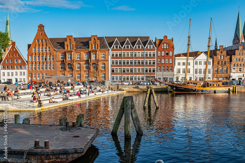 Photos Tourists and Lübeck locals enjoy hot summer days in the square of the swing bridge over the River Trave