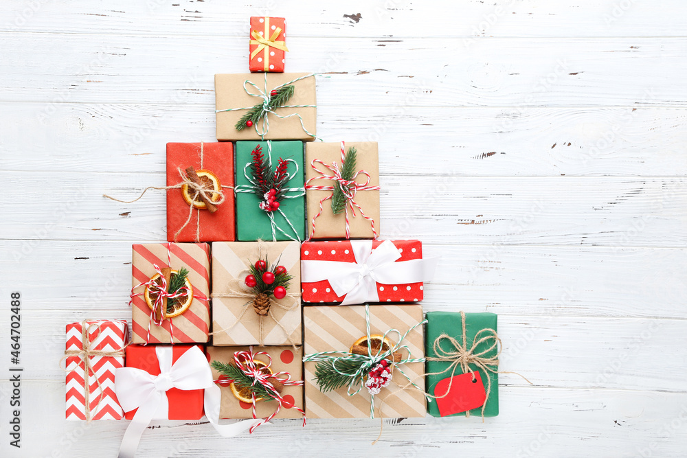 Fototapeta premium Gift boxes with ornaments on white wooden background