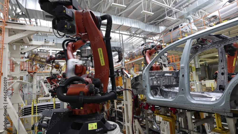 automated assembly of cars by robots, production safety in a modern factory automated assembly of cars by robots, production safety in a modern factory