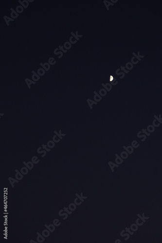 the moon that looks far away in the dark night © Lybov Lipskaya