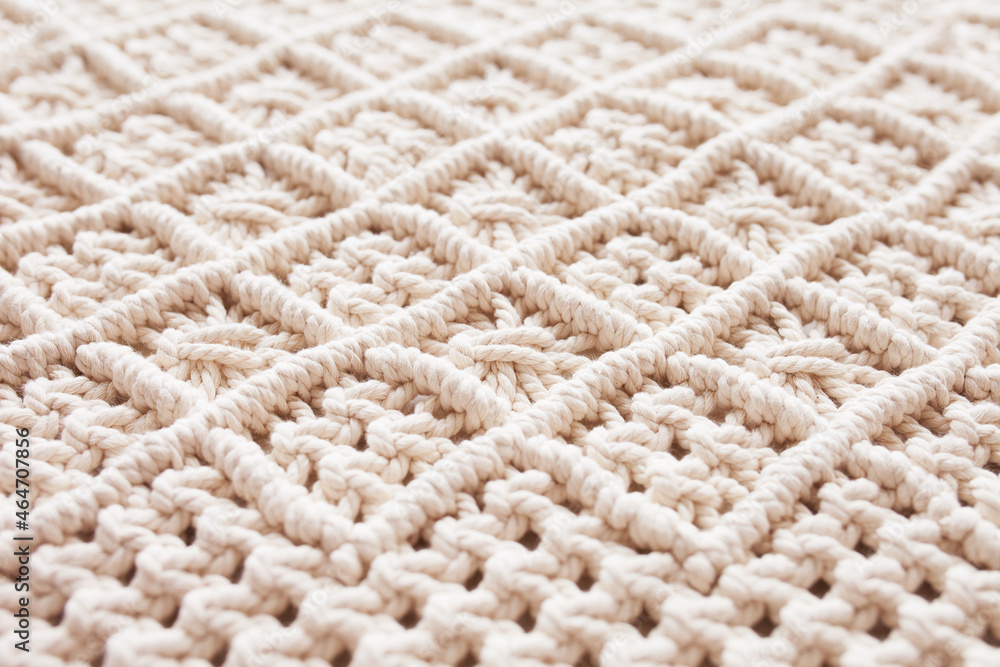 Handmade macrame. Macrame braiding and cotton threads. Female hobby. ECO friendly modern knitting DIY natural decoration concept in the interior. 100% cotton wall decoration. Handmade macrame. Macrame braiding and cotton threads. Female hobby. ECO friendly modern knitting DIY natural decoration concept in the interior. 100% cotton wall decoration.