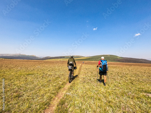 A cyclist and a trekker on the Snow Mesa, Colorado Trail, Colorado