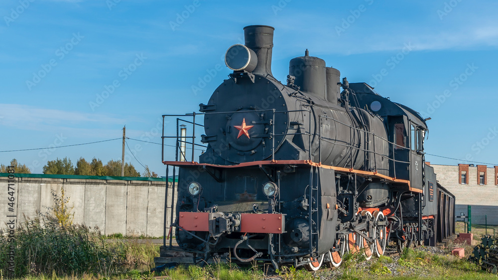 Naklejka premium Retro Soviet steam locomotive. Veteran railways. Vintage black steam locomotive train rush railway.