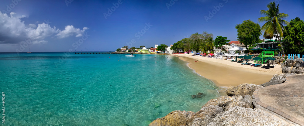 SPEIGHTSTOWN, BARBADOS; February 22, 2020: People swimming in the ocean in the Speightstown town, one of major town located on the west coast of island Barbados, Caribbean Islands