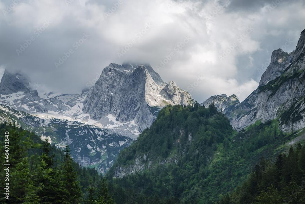 The Dachstein summit mountain range and visible glacier ice during summertime at Gosau, Upper-Austria, Europe The Dachstein summit mountain range and visible glacier ice during summertime at Gosau, Upper-Austria, Europe