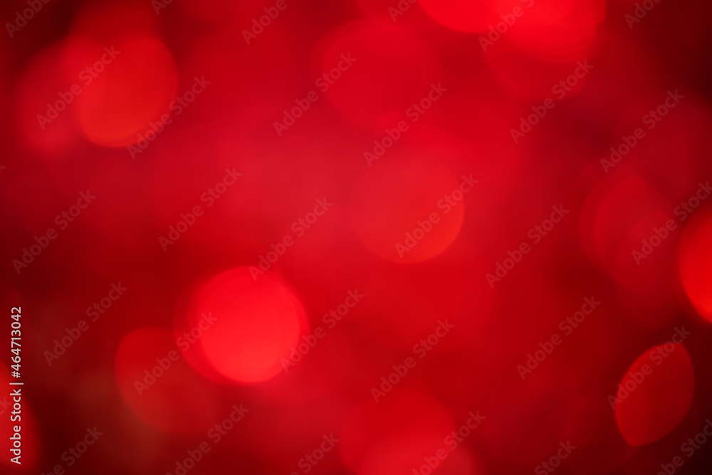 Defocus light on red with black background. The fabric with sequins is out of focus.