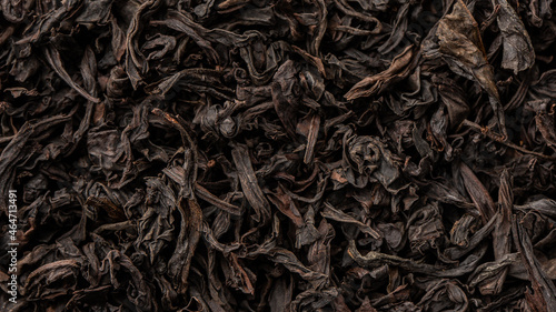 Obraz na płótnie Heap of dry tea leaves. Dried black tea. Textured background of dried leaves of aromatic black tea with cinnamon w salonie