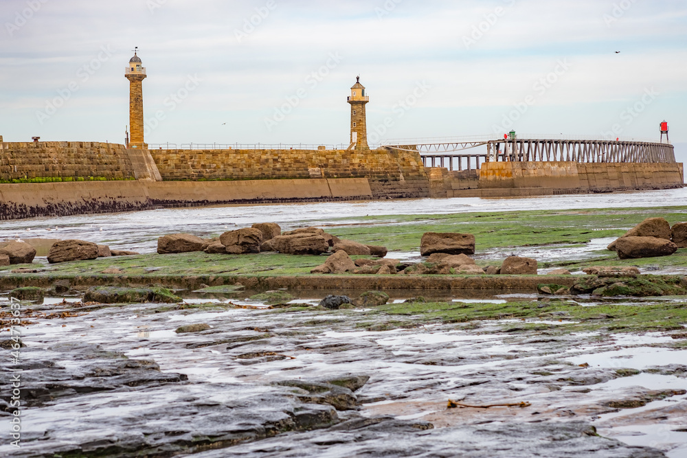The bay at East Cliff and Whitby East Pier captured at low tide on an autumn day