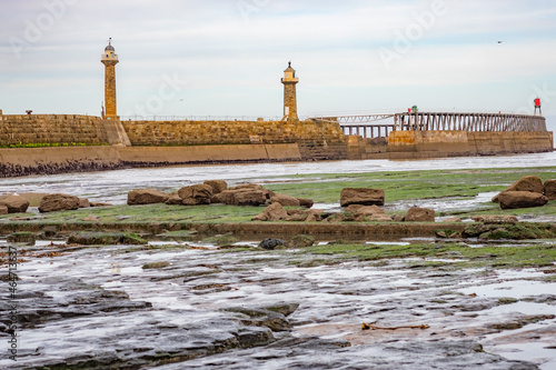 The bay at East Cliff and Whitby East Pier captured at low tide on an autumn day