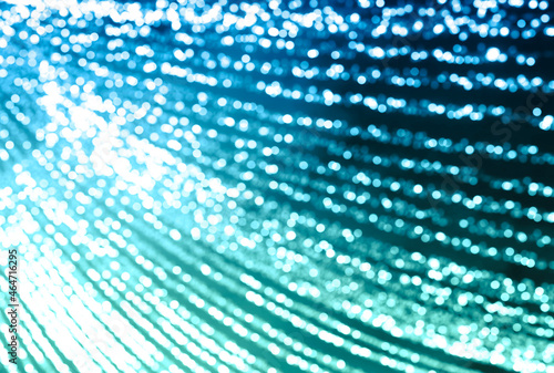 Blurred background of glowing garlands with bokeh effect on the background of the evening sky. New Year background template for greetings.