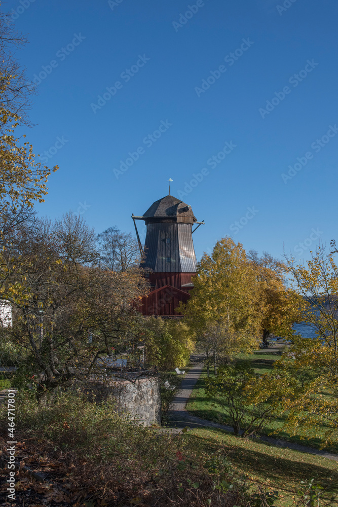 Old wind mill for production of linseed oil at the Cape Waldemar, Waldemars udde, a colorful autumn day in Stockholm Old wind mill for production of linseed oil at the Cape Waldemar, Waldemars udde, a colorful autumn day in Stockholm