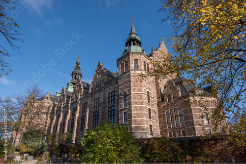 Old Gothic museum building with towers from 1873 a colorful autumn day in Stockholm