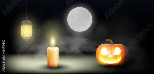 halloween pumpkin, Jack O Lantern, with an evil face and eyes on a wooden bench, table with a misty gray coastal night background with space for product placement.