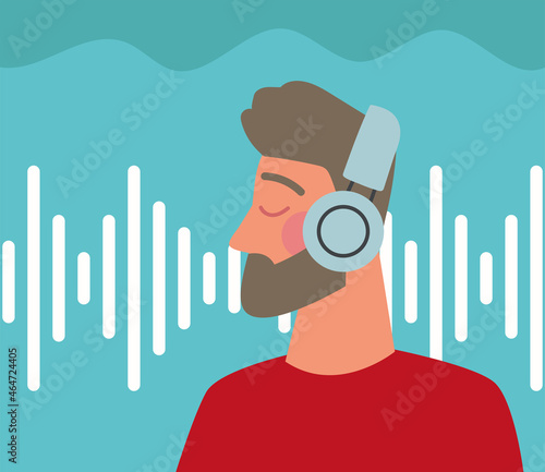 bearded man using earphones