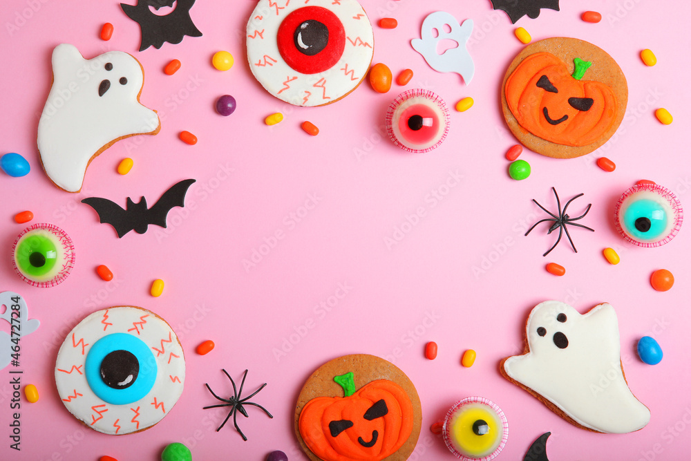 Halloween sweets on colored background close up top view with place for text Halloween sweets on colored background close up top view with place for text