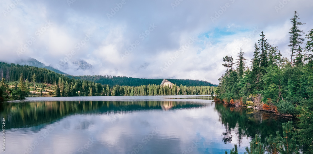 Panoramic spectacular view to Strbske Pleso in High Tatras - a mountain lake at 1350m. Popular trekking routes, ski resort, and relaxing in Nature destination in Slovakia.