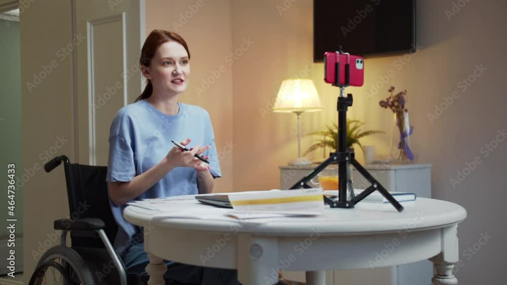 A disabled woman is showing charts on the phone A disabled woman is showing charts on the phone