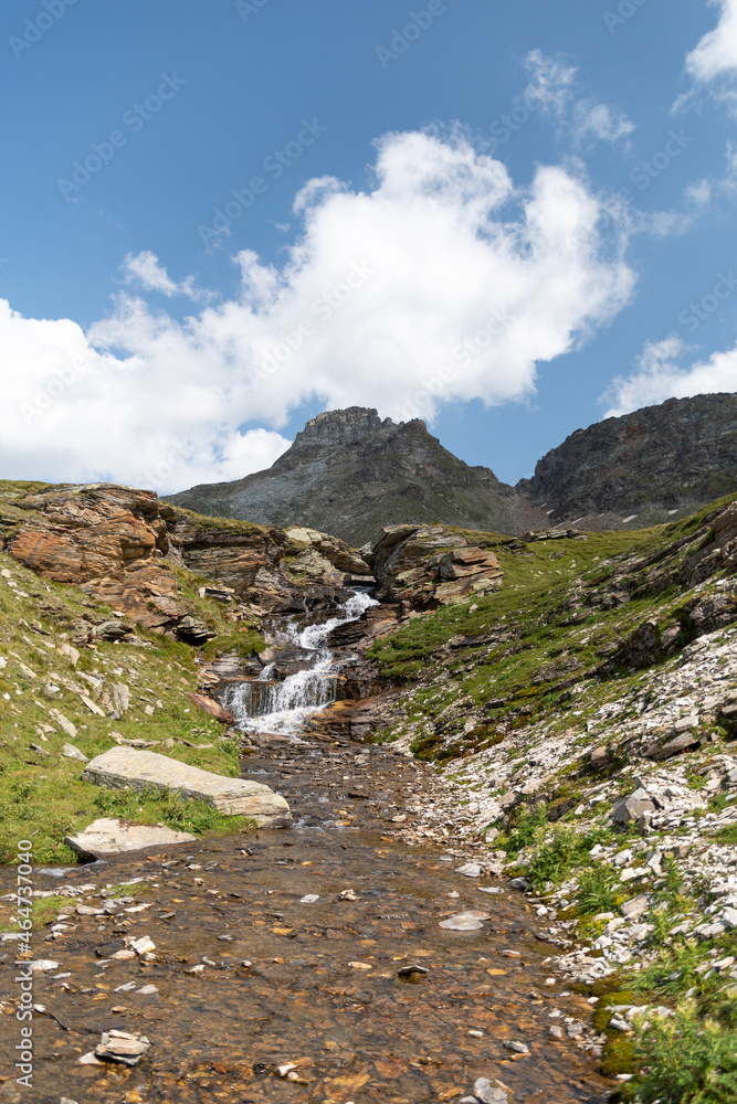 Obraz premium Vals, Switzerland, August 21, 2021 Little waterfall in the alps