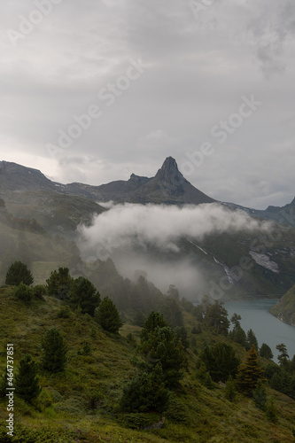 Vals, Switzerland, August 22, 2021 Fog around the mount Zervreila in the morning