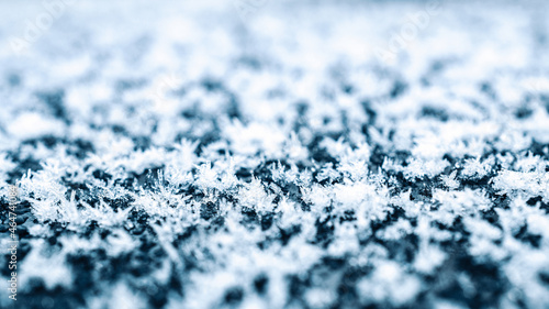 Frozen ice texture. Cold snow winter background. Blue crystal frozen abstract pattern. White frost ice texture.