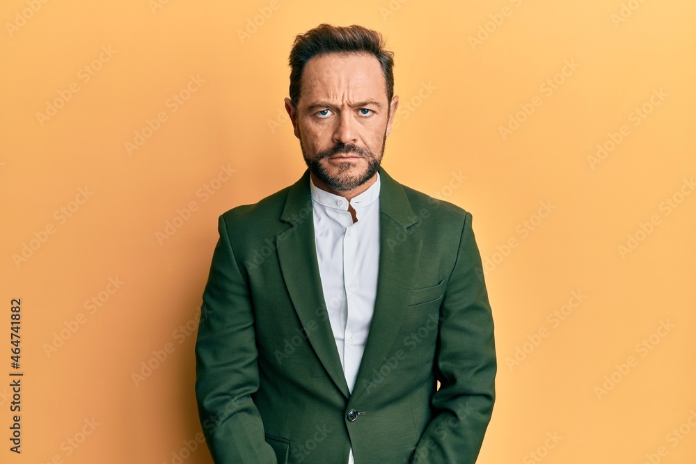 Middle age man wearing business suit depressed and worry for distress, crying angry and afraid. sad expression. Middle age man wearing business suit depressed and worry for distress, crying angry and afraid. sad expression.