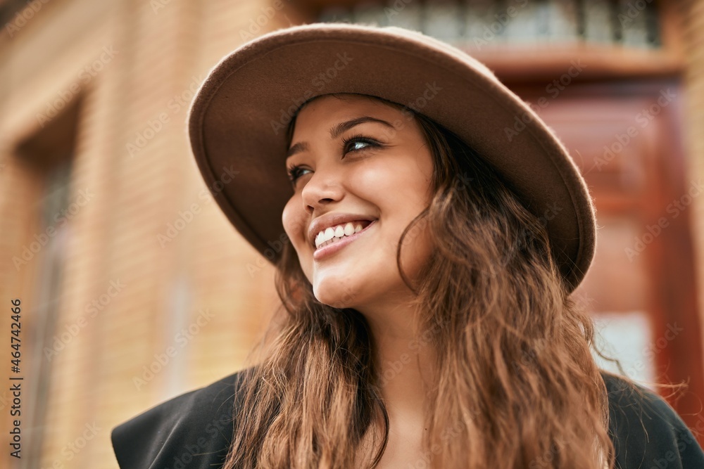 Young hispanic tourist woman smiling happy standing at the city. Young hispanic tourist woman smiling happy standing at the city.